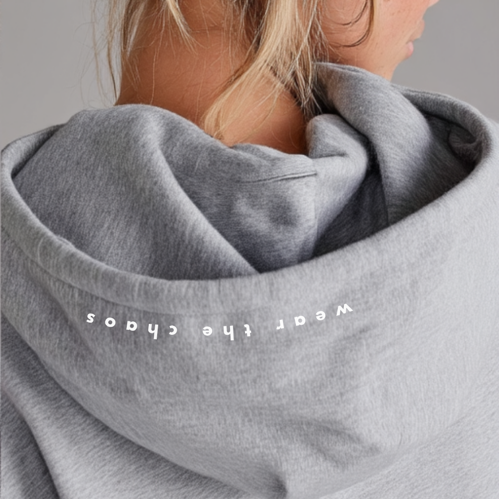 Gray sweatshirt with 'Wear the Chaos' text on a plain background