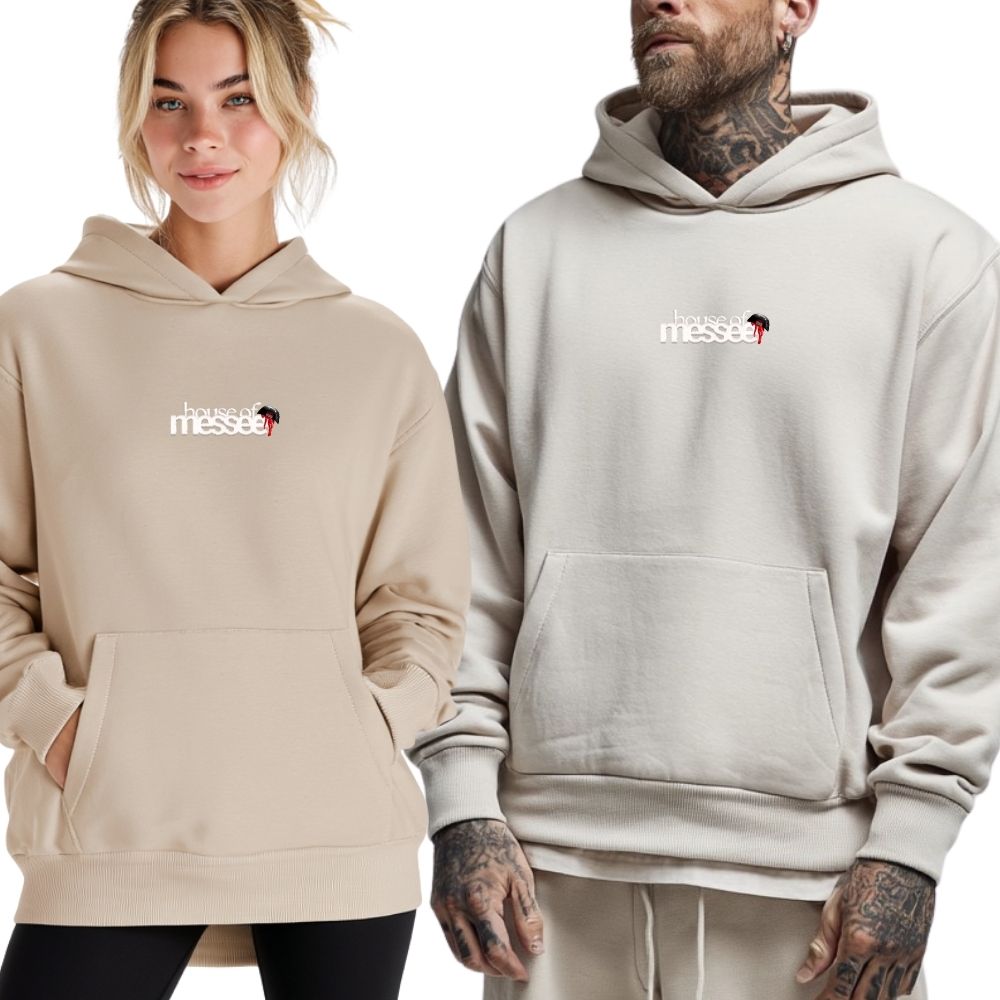 Two people wearing beige hoodies with a logo on a white background