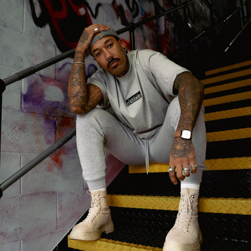 Person wearing grey oversized tshirt