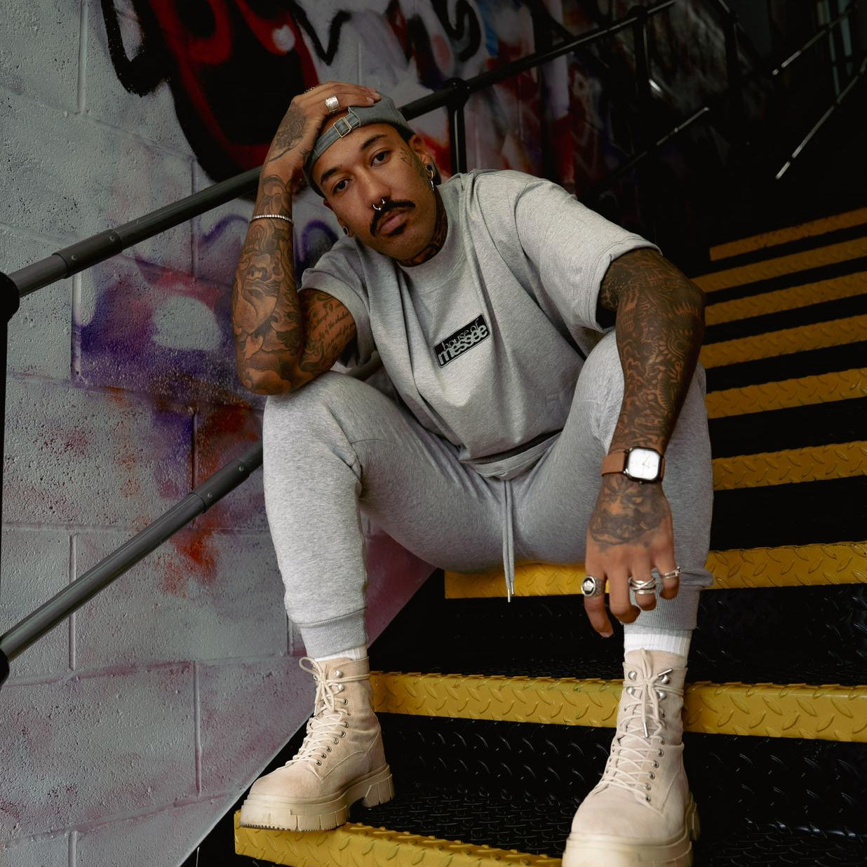 Person wearing grey oversized tshirt