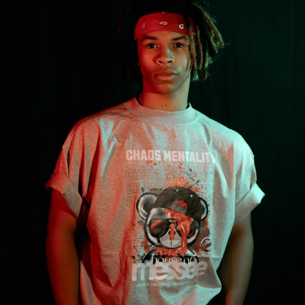 Person wearing grey oversized tshirt with graphic print